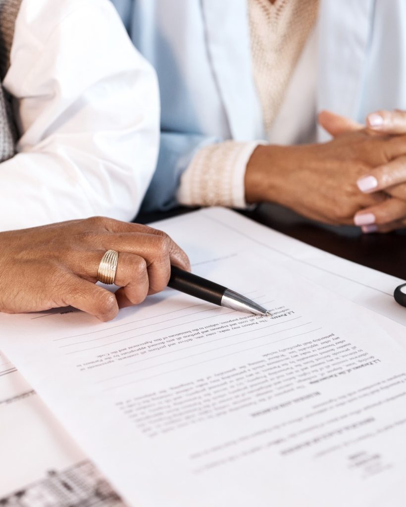 Contract, paper and people hands with document for legal advice, law firm strategy and negotiation